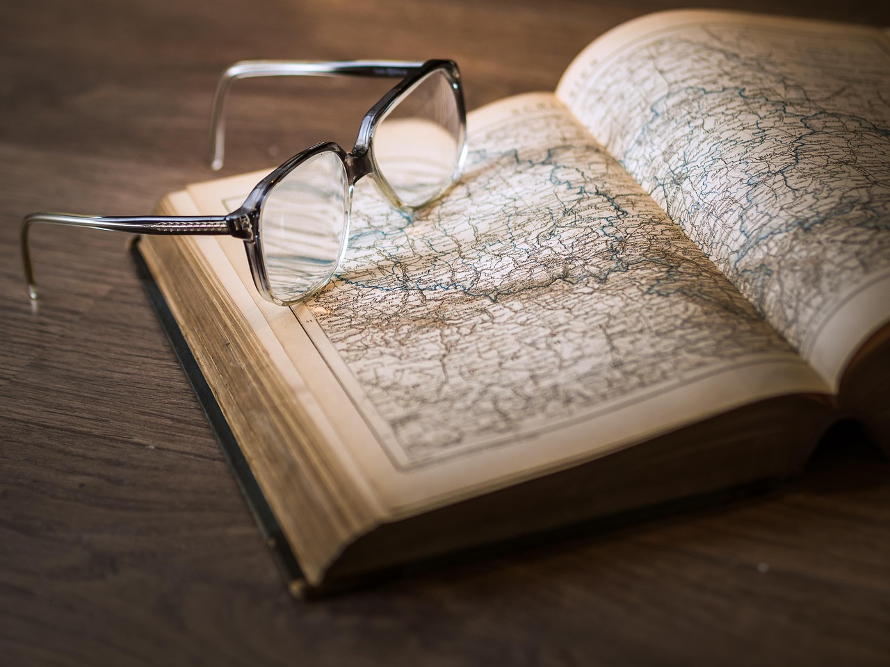 Atlas, book, glasses — How to Get Started With Online Poker
